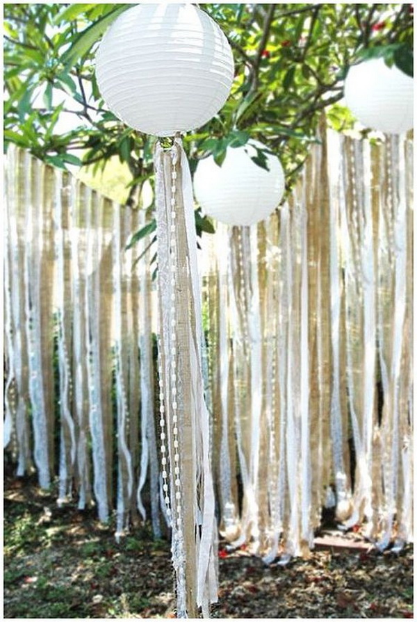 Vintage Wedding Backdrop Using Paper Lanterns and Ribbons. 