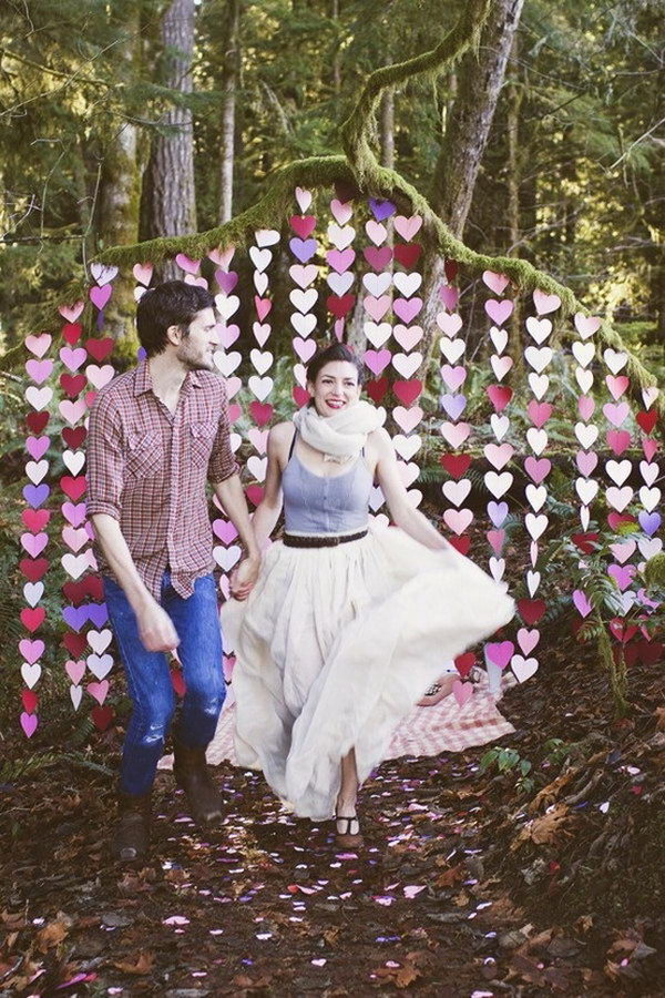 Small Paper Hearts with Rustic Branches Outdoor Photo Backdrop. 