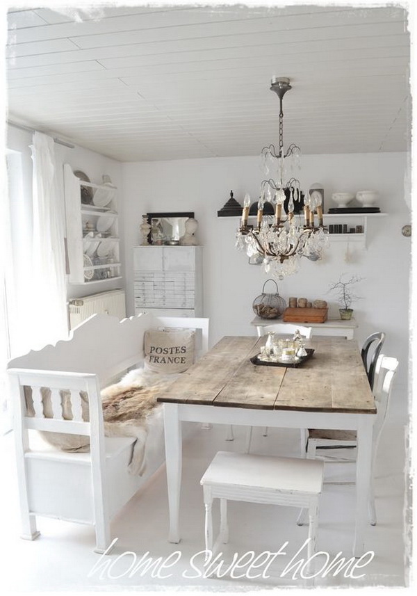 Whitewashed shabby chic dining room with a touch of rustic warm. 