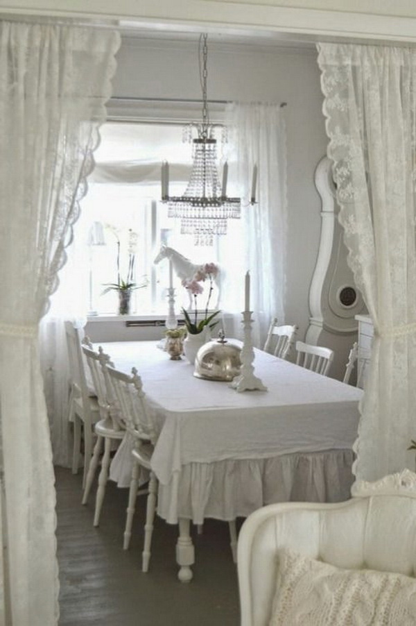 Shabby chic dining room with lace curtains. 