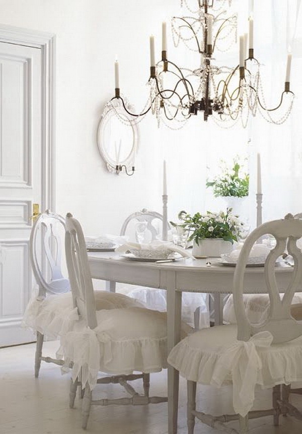 White dining room with rustic chic chandelier. 