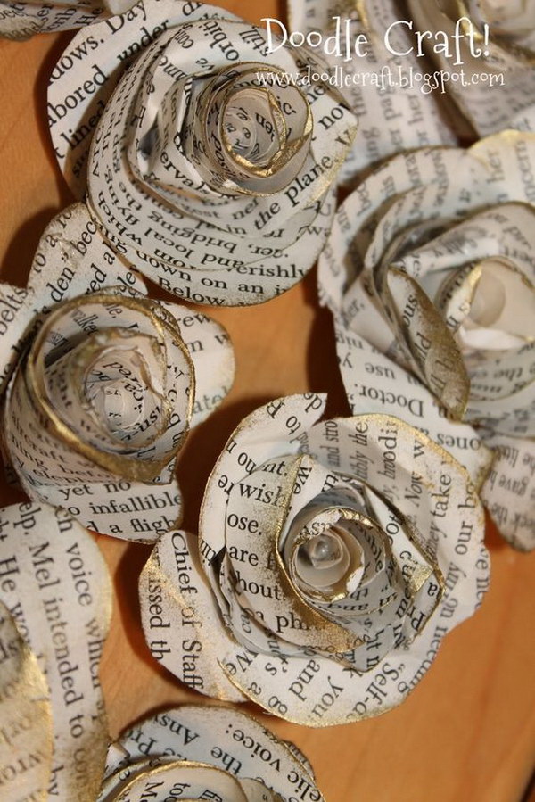Antique Book Page Handmade Large Spiral Paper Flowers. These large spiral paper flowers are made from vintage book pages and finished off a bit of gold glitters.