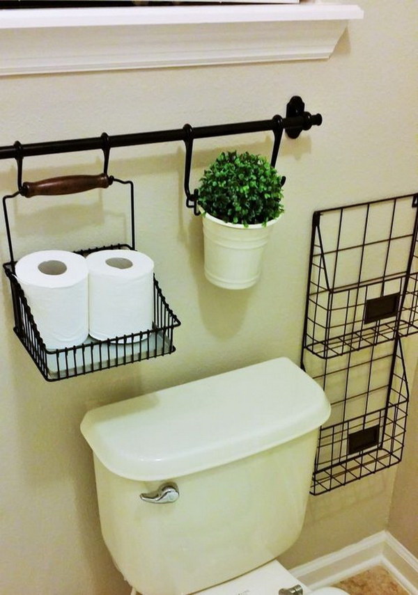 Use IKEA Curtain Rods For Over The Toilet Storage. 