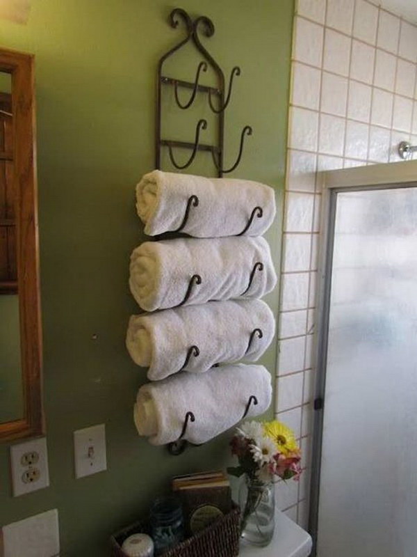Wine Rack Used As A Towel Rack Over The Toilet. 