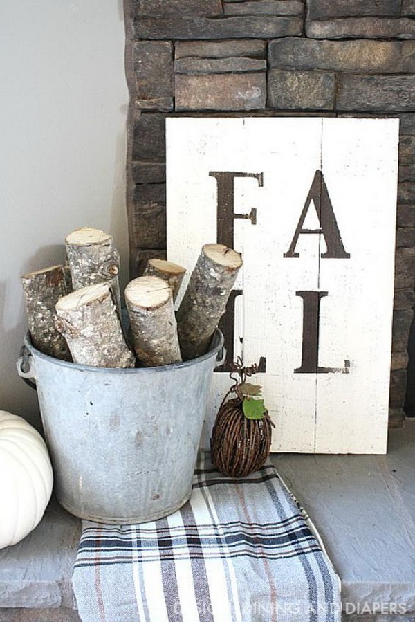 DIY Rustic Fall Sign. Gathering cut birch logs or branches of leaves in a container and creating a rustic palette inspired fall sign to create a beautiful vignette.