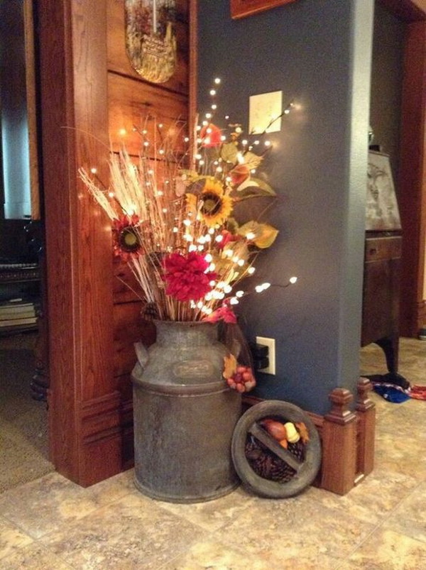 Rustic Fall Centerpiece for Front Porch. Love this fall decor! Arrange some fall natural elements, like sunflowers, wheat and branches into an old bucket and add some fairy lights.