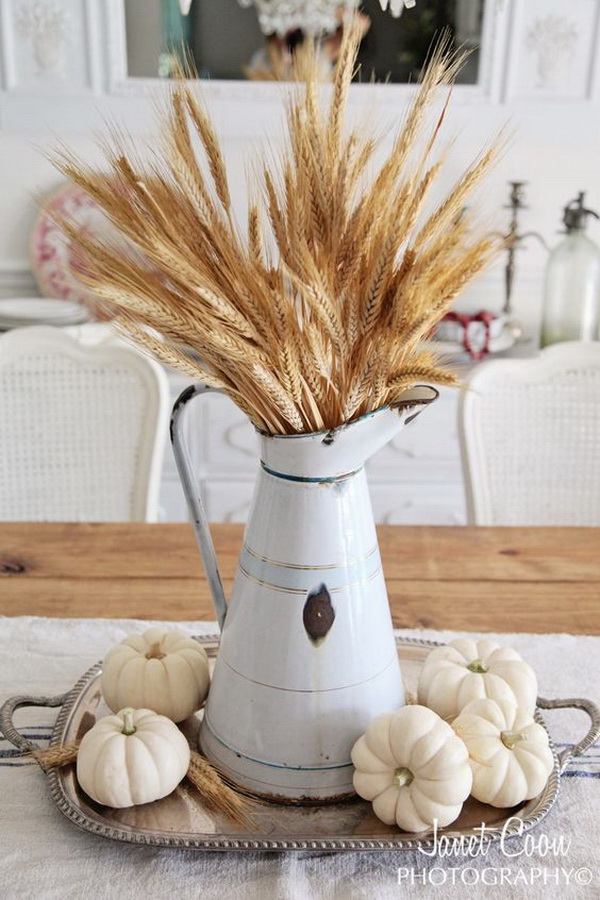 Pumpkin and Wheat Fall Centerpiece. Bring the touches of autumn and a cozy “farmhouse” feel to your home with this easy centerpiece made with wheat and pumpkins.