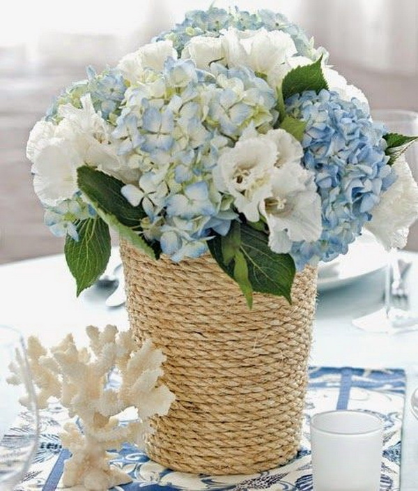 DIY Rope-Wrapped Vase. Transform the simple vase into a summer-themed centerpiece with just a few supplies in no time! It looks so pretty and has a seaside feel for your summer wedding decoration or any other outdoor theme.