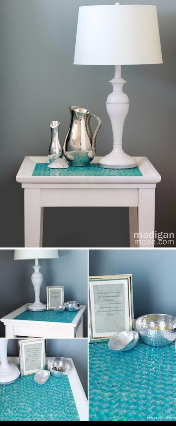 DIY Tile Table With Glass Gems. Turn a boring old side table into something beautiful and seemingly expensive with a package of glass gems or stones at the Dollar Store. It’s also perfect for the beach home decor. 