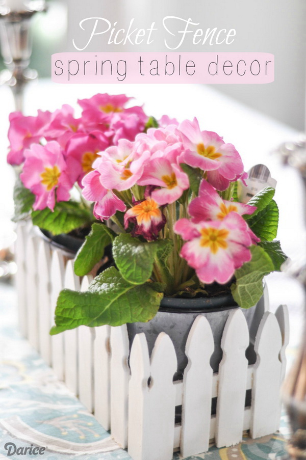 Spring Picket Fence Table Centerpiece. Create a darling centerpiece with unfinished picket fence container with just a few supplies! It is so easy to make in no time! 