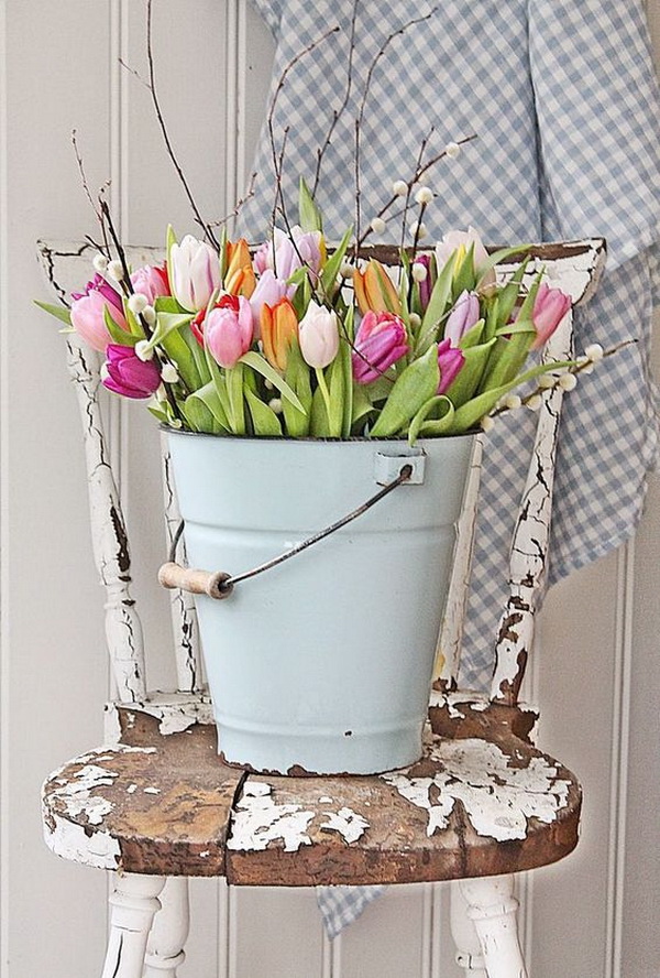 Metal Bucket Tulips Display. Display tulips in a chippy metal bucket! So simple and perfect for Spring and Easter decoration with a touch of shabby chic charm!
