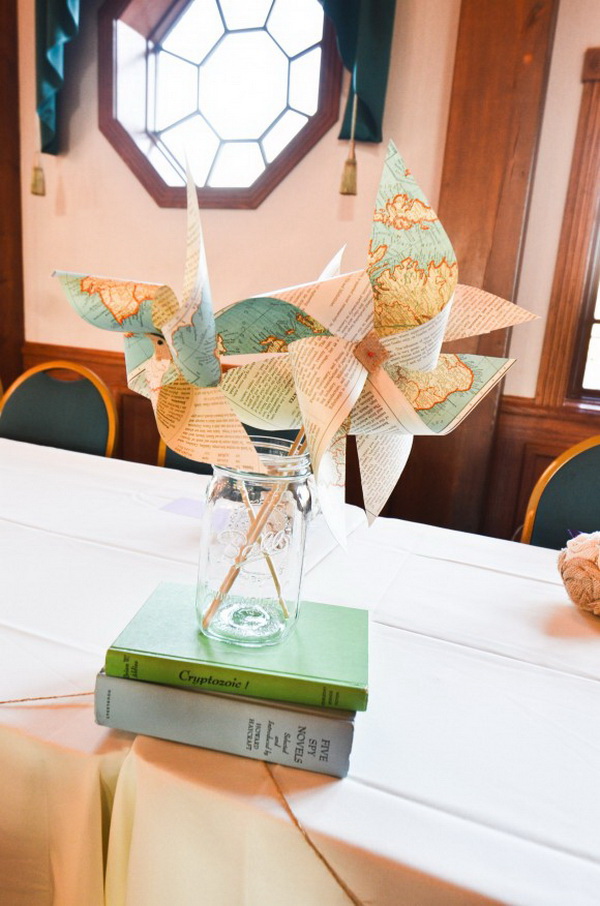 Create this easy DIY pinwheel centerpiece with old maps and a classic mason jar for a simple yet whimsical display. It is super fun and easy to make in about 15 minutes! 