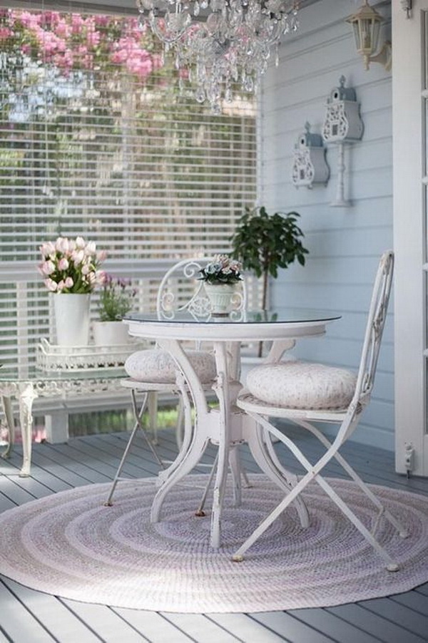 Beautiful shabby chic balcony. Refresh your garden or balcony in the spring with the warm and comfortable shabby chic style! Vintage pastel colors, delicate round rug, the crystal chandelier...All looks so bright, cozy and inviting! 
