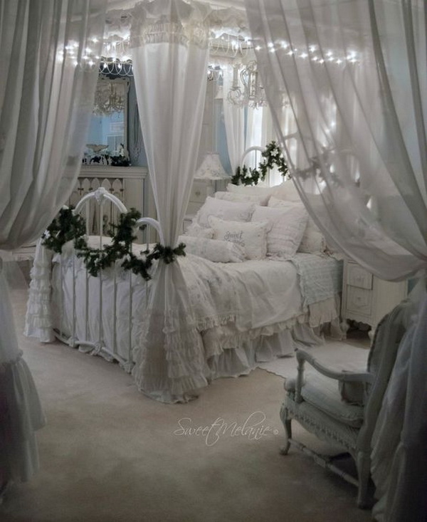 Romantic white shabby chic bedroom. Heavy use of vintage distressed white for an ambience of old fashioned charm and romance. 