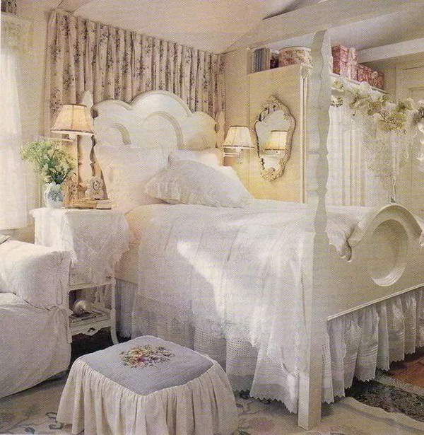 Shabby chic bedroom with floral prints beddings, vintage furniture.