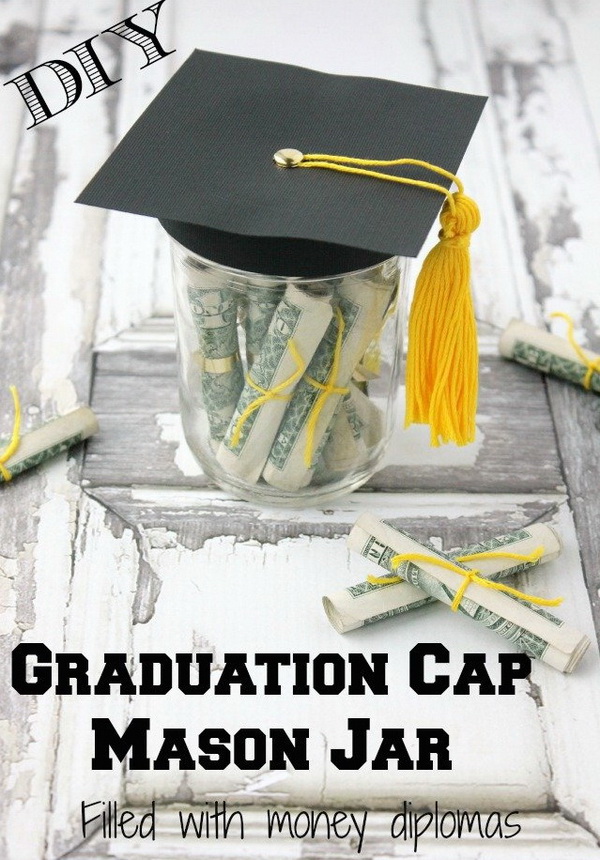 Graduation Cap Mason Jar Filled With Money Diplomas. A mason jar filled with dollar diplomas with a paper graduation cap with a tassel! This can not only be a cool graduation party decoration idea, but also a grea graduation money gift! 