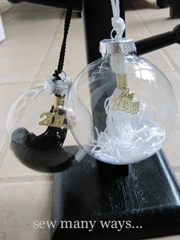 Graduation Tassel Ornaments. Make a graduation tassel ornament using clear glass Christmas ornaments. It makes the perfect gift idea and a creative graduation decor craft! 