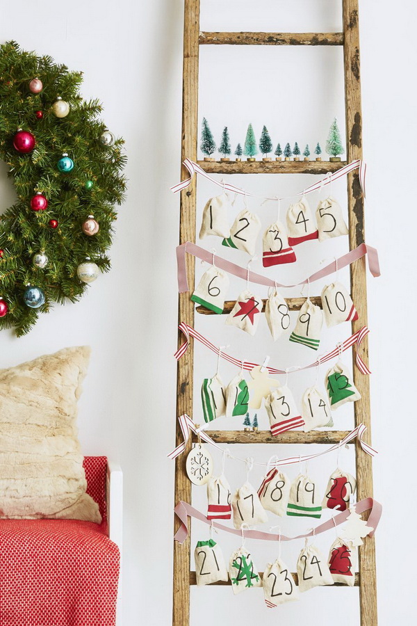 Ladder Advent Calendar Decorated with Muslin Craft Bags. 